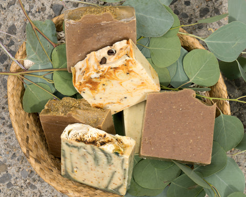 a basket with 6 bars of natural soap placeed on top of Eucalyptus leaves